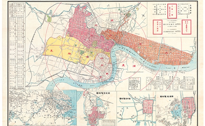 至誠堂『上海地図』（開新社印刷、1925年）。黄色い部分がフランス租界、ピンクとオレンジ色の部分が主にイギリス、アメリカによる共同租界だ。日本人が多く居住したのは、共同租界の中の虹口という地区であった。